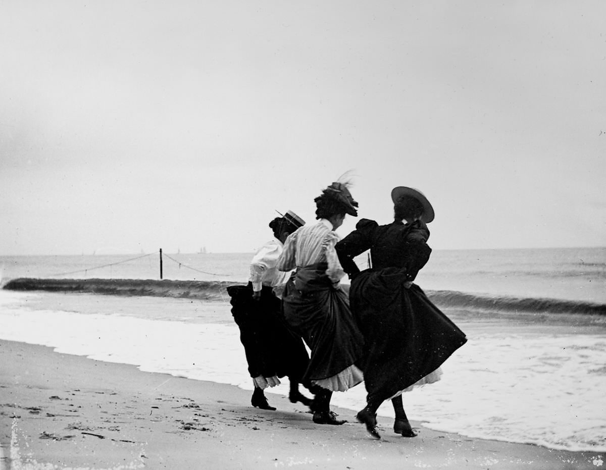 Gertrude Hubbell, Ruth Peters, and Mildred Grimwood play near the water at Arverne, Queens.Sept. 8, 1897