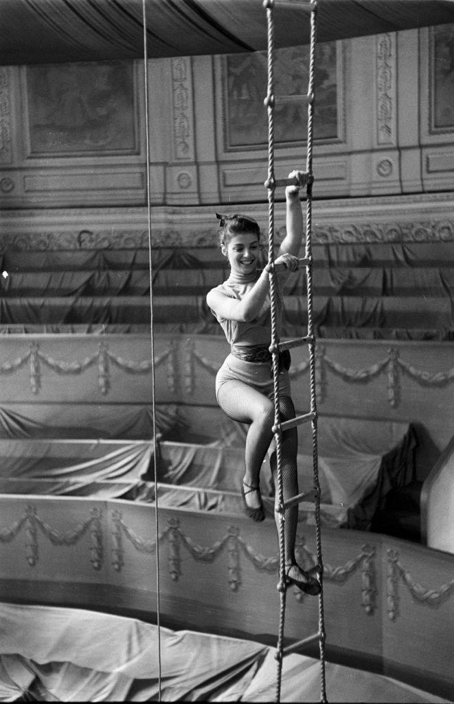 Pier Angeli climbing a rope ladder in the set of 'The Story of Three Loves', United States, circa 1953