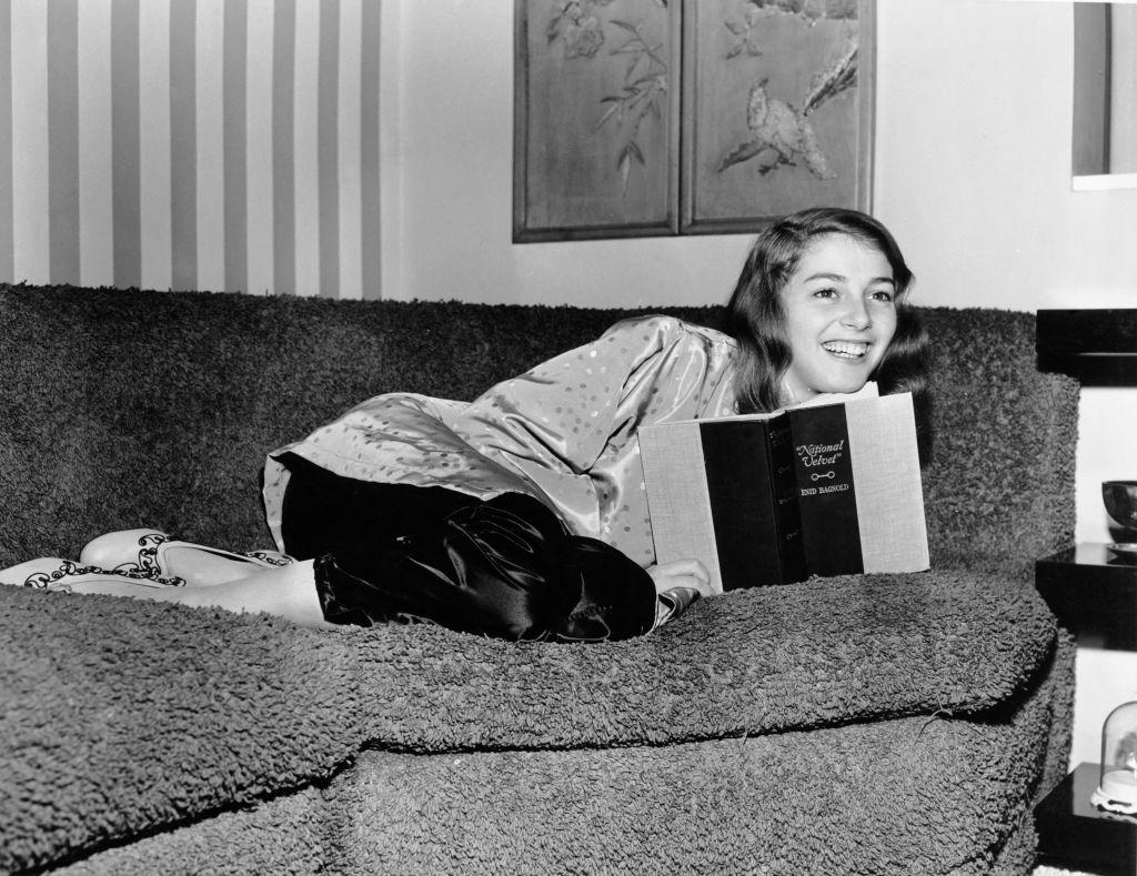 Pier Angeli reading a copy of the book 'National Velvet' by Enid Bagnold, circa 1950