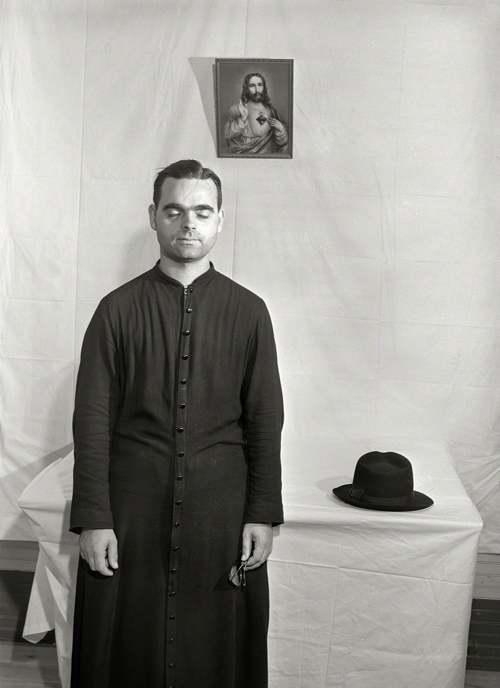 Priest who conducted a Mass and baptism and blessing of the houses at the tenant purchase celebration, Corozal, Puerto Rico, December 1941