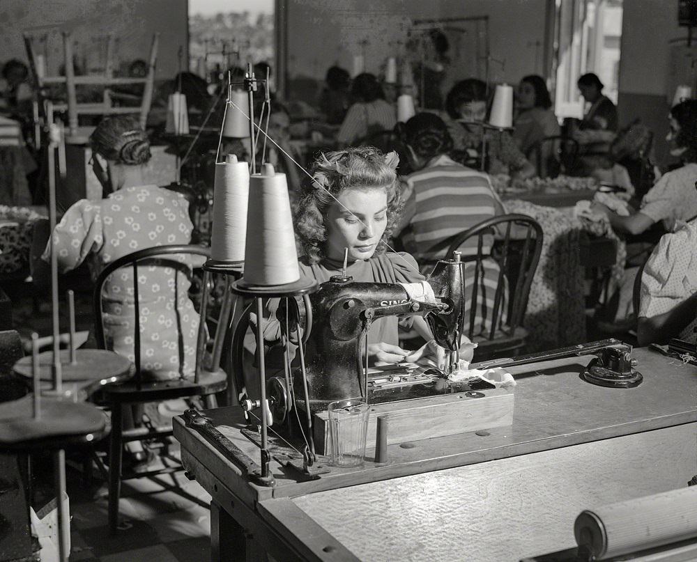 Women workers sewing dress in a factory, San Juan, Puerto Rico, December 1941