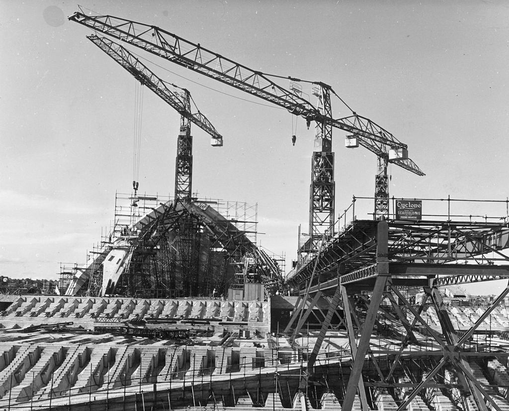 The roof is lifted onto the new Opera House being constructed in Sydney harbour, 10th December 1963