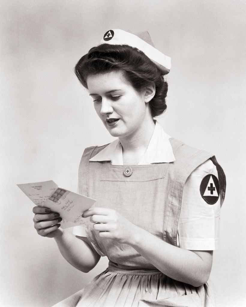 Red Cross Nurse wearing uniform smock dress, WWII