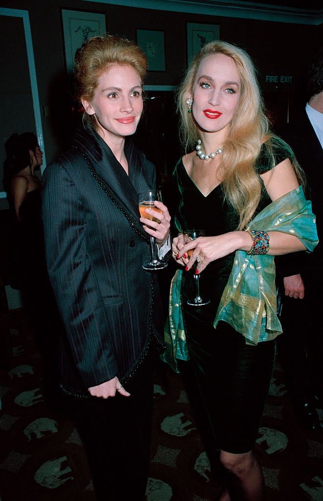Julia Roberts with fashion model Jerry Hall at a party after the London premiere of the film 'Steel Magnolias', 1990