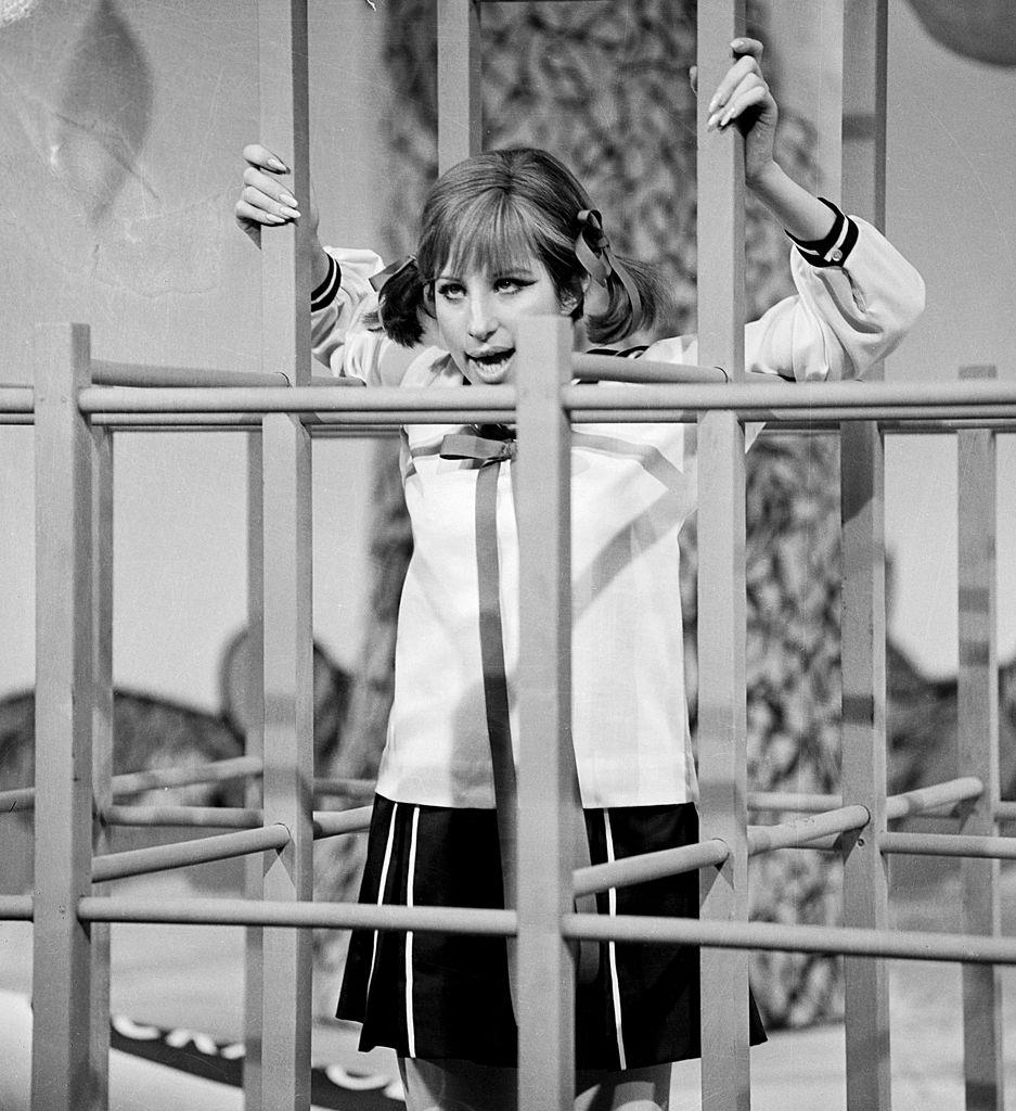 Barbra Streisand performs a song in a jungle gym set dressed as a little girl during her 'My Name is Barbra' 1965