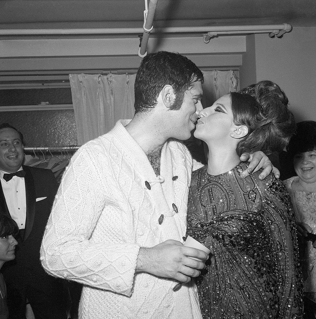 Barbra Streisand kissing Elliott Gould, 1965