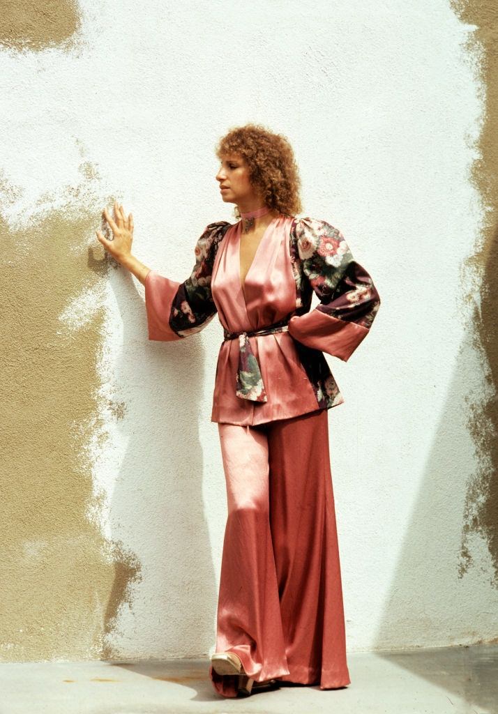 Barbra Streisand leaning against a wall, Malibu, California, 1975