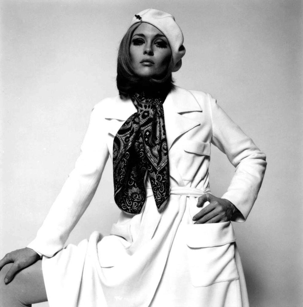 Faye Dunaway, in a white beret and coat and paisley scarf, 1969