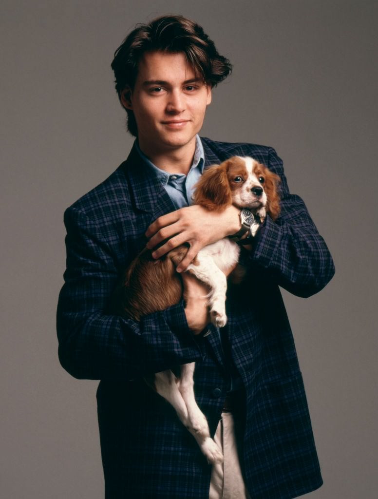 Johnny Depp holding a dog, 1988