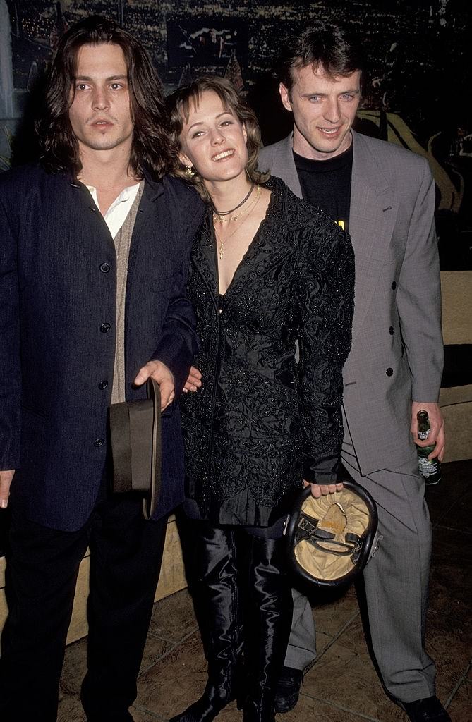 Johnny Depp with Mary Stuart Masterson and Aidan Quinn at the Planet Hollywood in New York City, 1993