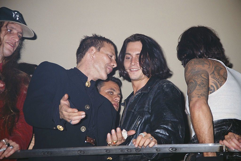 Johnny Depp with Mickey Rourke at a party being held for Mickey Rourke's birthday, September 1994