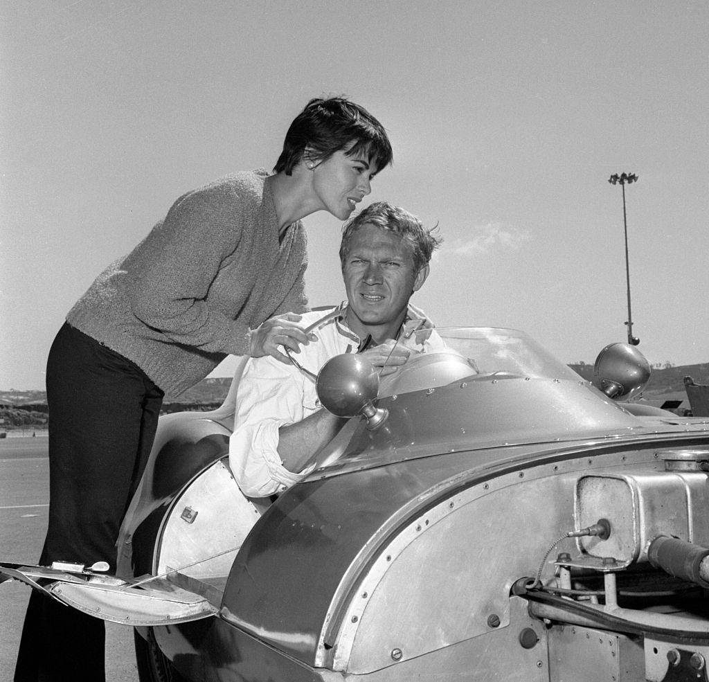 Neile Adams with her hsuband Steve McQueen in 1959 Lotus Eleven racing car at Del Mar raceway, San Diego, California.