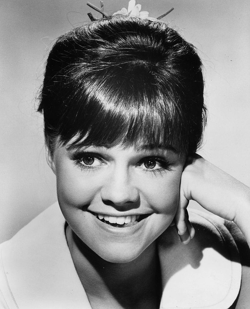 Sally Field smiling with her hand on her cheek, 1965