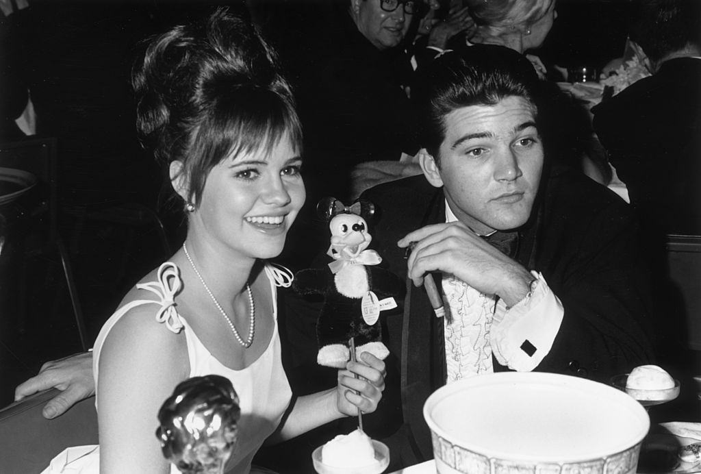 Sally Field and her date, Paul Peterson, seated at a Hollywood event, 1966