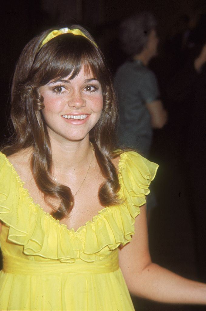 Sally Field in a sleeveless yellow dress, 1968