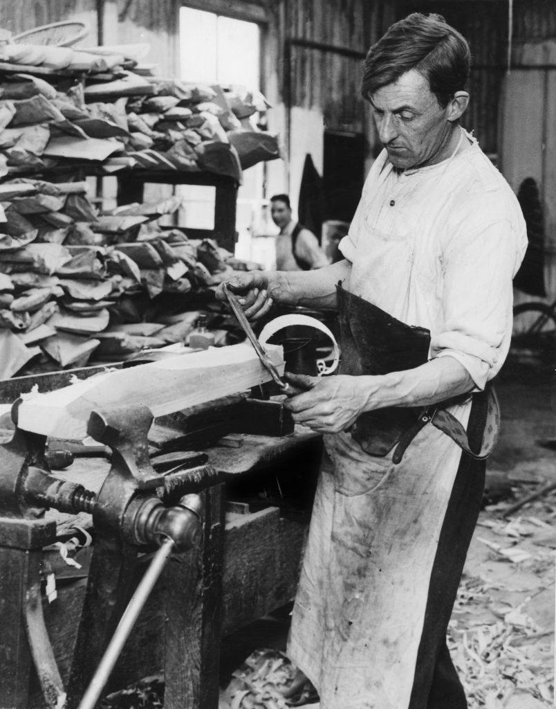 A craftsman making a cricket bat in a Midland sports manufacturers factory, 1932.