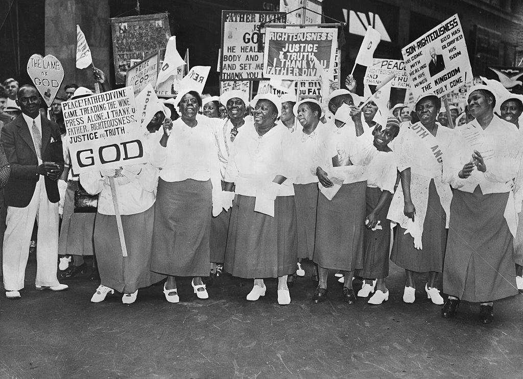 A Harlem woman in a Father Divine parade, New York City, 1930s.