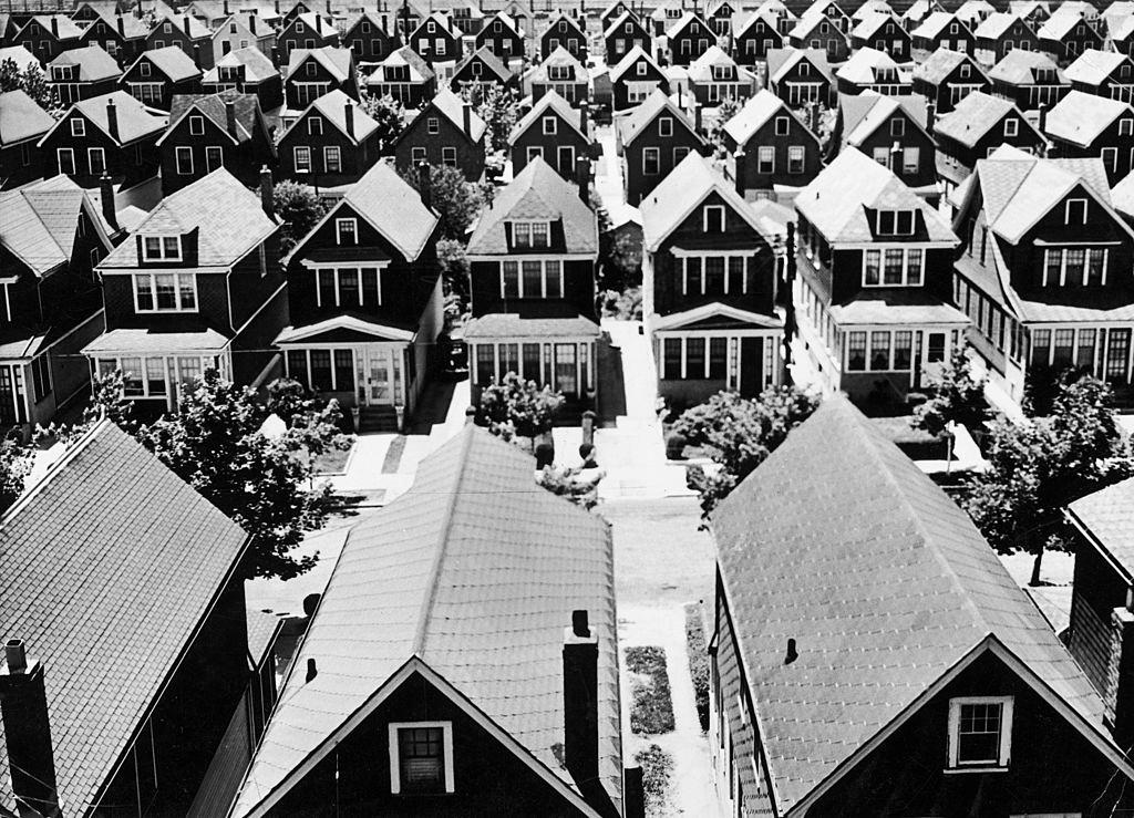 Aeriel view of a neighborhood of nearly identical houses, New York City, 1930s