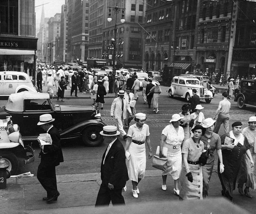 Crowded Manhattan sidewalk, New York City, 1930s.