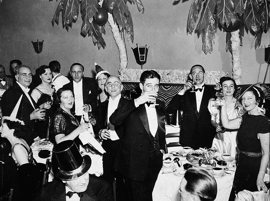A group of people in formal attire celebrate on New Years Eve at the El Morroco night club in New York City, 1935.