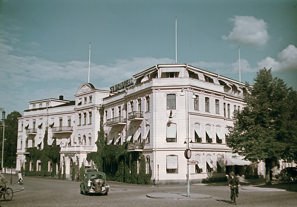The City Hotel in Karlstad, at 22, Kungsgatan street (King Street), and a producer gas driven car, 1943