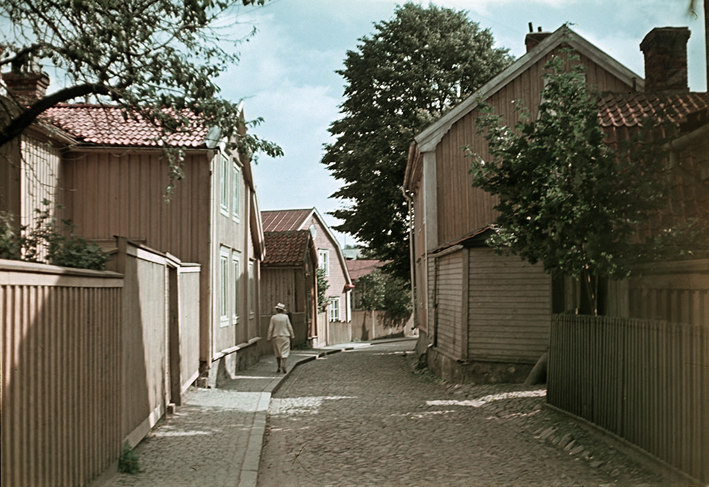 A woman walking in Västerlånggatan street, 1945
