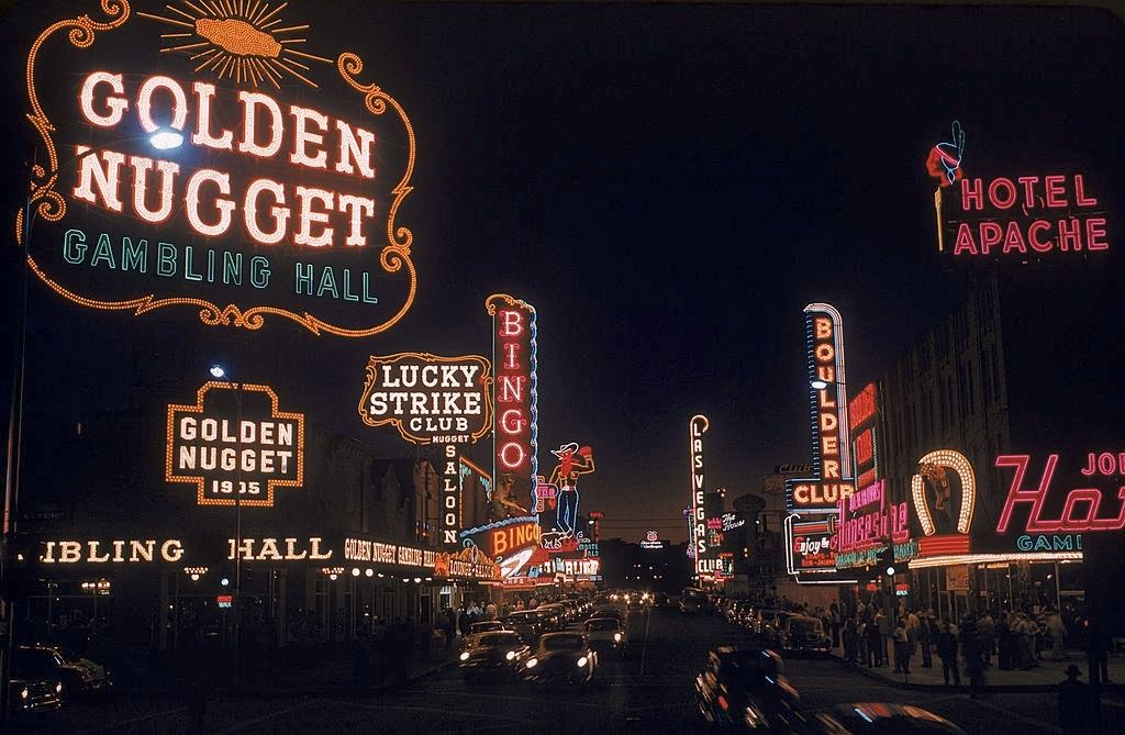 View of the illuminated sign of casinos and hotels along Fremont Street, Las Vegas, 1955