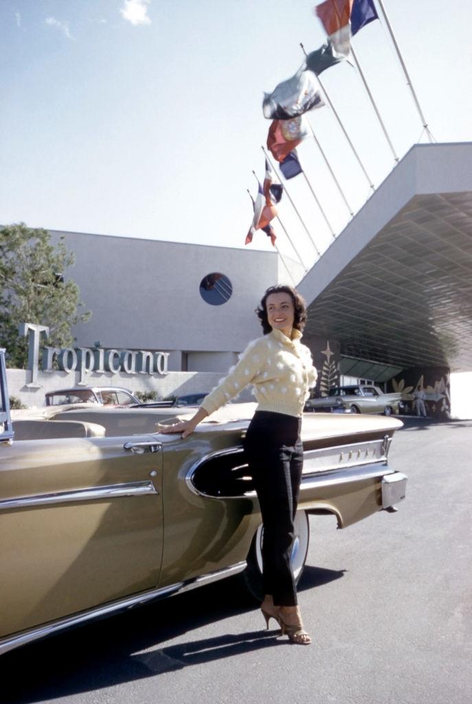 Actress and model Kitty Dolan poses next to a 1958 Ford Edsel Citation outside The Tropicana Hotel, Las Vegas, 1958.