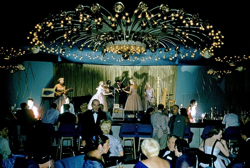 Musicians perform on stage behind the bar in the Riviera casino, Las Vegas, 1955.