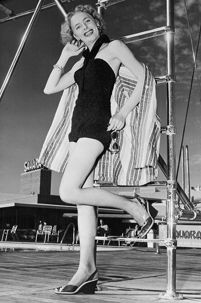 Christine Jorgensen, posing in a bathing suit at the Hotel Sahara Pool in Las Vegas, 1955.