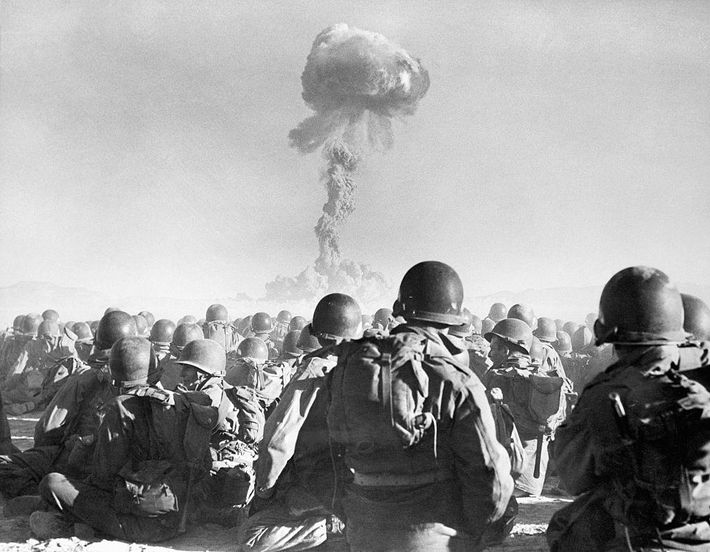 Airborne division troops watch an atomic explosion at close range at the AEC's testing grounds in the Las Vegas desert, 1951.