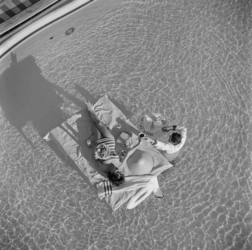 Austrian actress Mara Lane enjoys waiter service in the pool at the Sands Hotel, Las Vegas, 1954.