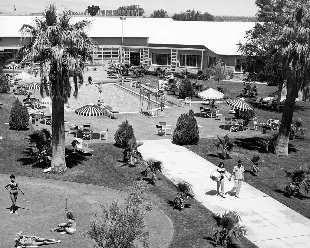 The outdoor pool and patio scene at the Thunderbird Resort, Las Vegas, 1956.