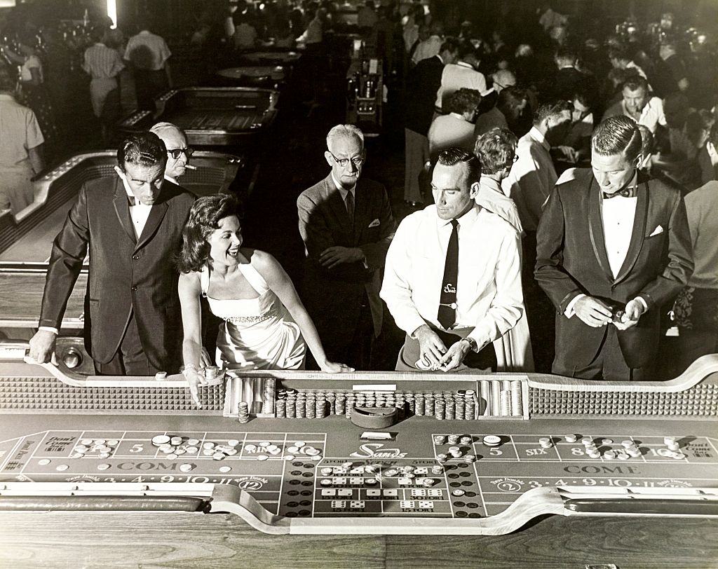 A group stands at The Sands craps table, Las Vegas, 1959