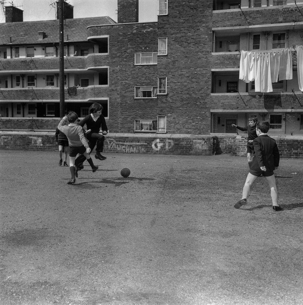 A group of children playing football in Juvenal Gardens, Liverpool, 1971.