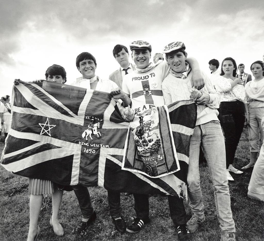 Young men with their flag during the annual Orange Order march in Liverpool