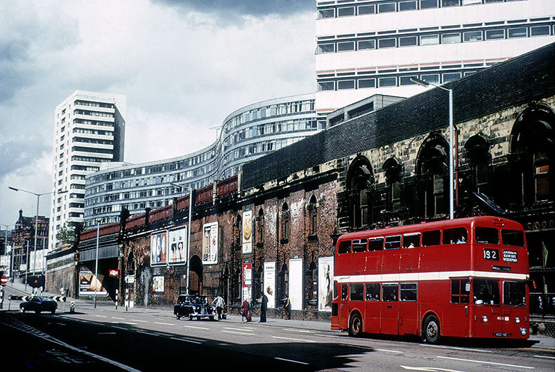 Manchester’s famous red buses became grotesque pop orange and brown (London Road, 1975)