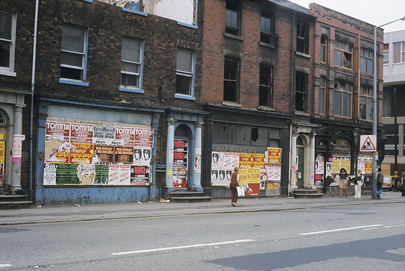 Boarded-up shops (once Georgian houses) on the west side of Oxford Road at All Saints, Manchester, 1976