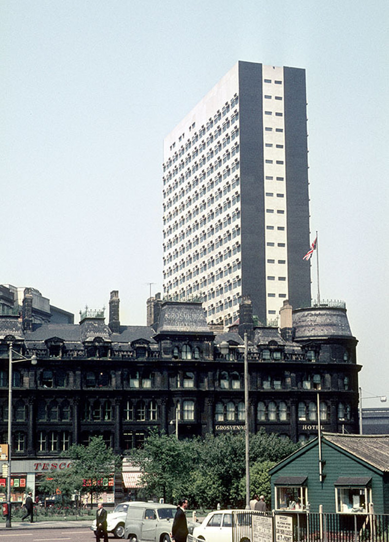 View of Highland House on Victoria Bridge Street, designed by Leach Rhodes Walker and built in 1966. In the foreground is the Grosvenor Hotel at the northern end of Deansgate, demolished c. 1970.