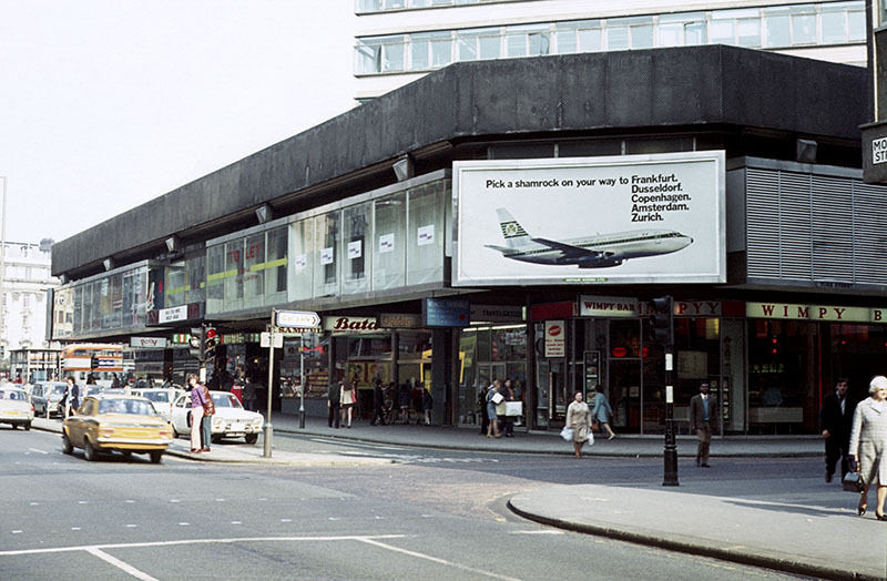 View of Mosley Street at its junction with York Street in 1972, showing shops in the podium element of the Piccadilly Plaza development.