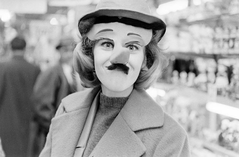 Jane Fonda put on a mask with moustache and a long nose in a drugstore.