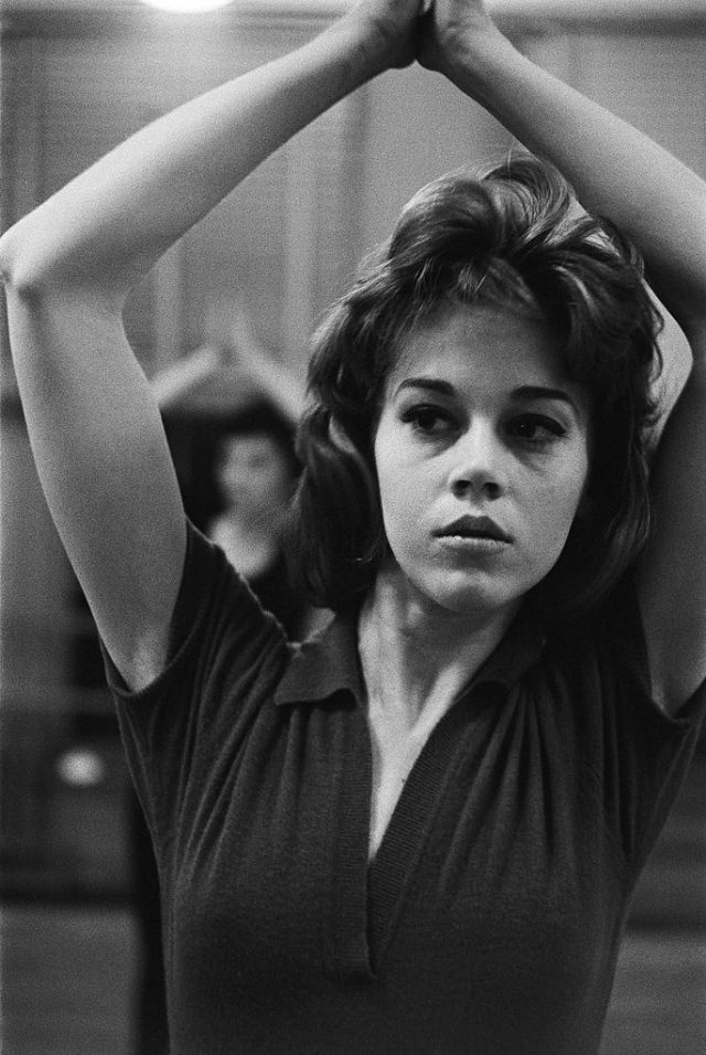 Close look of Jane Fonda taking dance lessons.