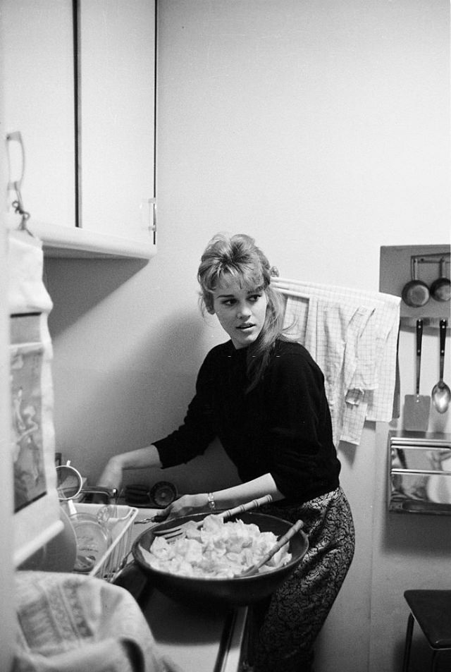 Jane Fonda preparing the meal in the kitchen at her apartment.