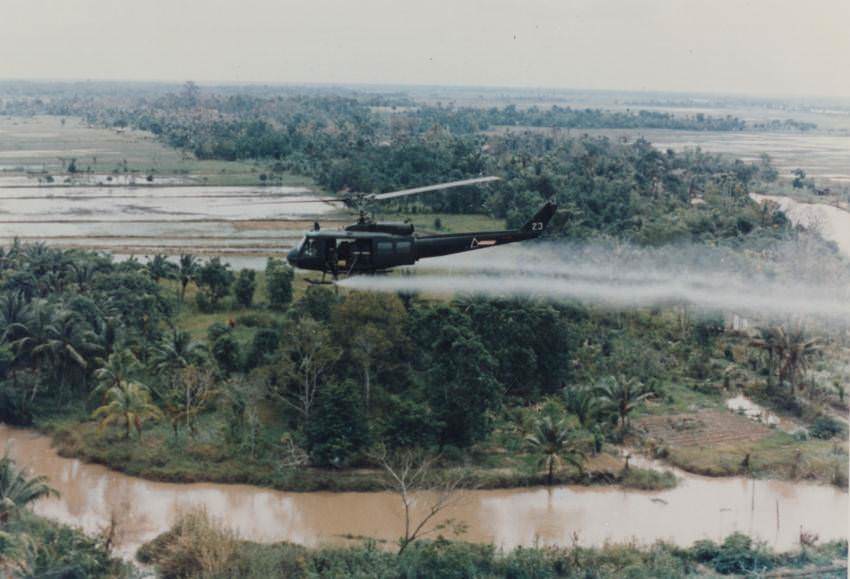 A helicopter sprays Agent Orange, Vietnam, 1969