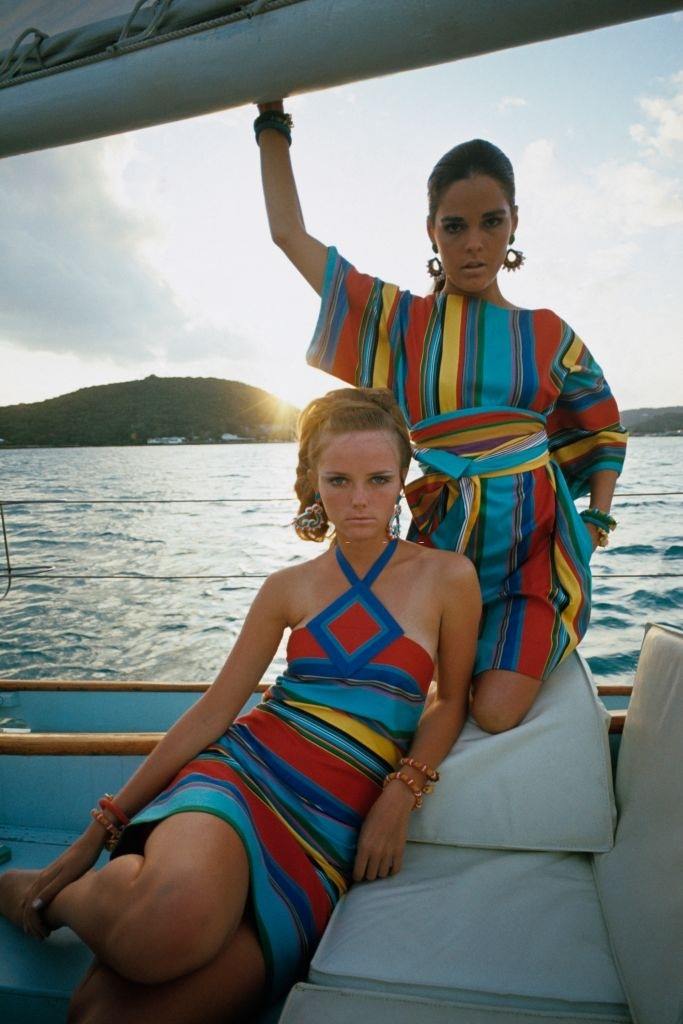 Ali MacGraw with Cheryl Tiegs on a sailboat during a fashion photoshoot, 1967.