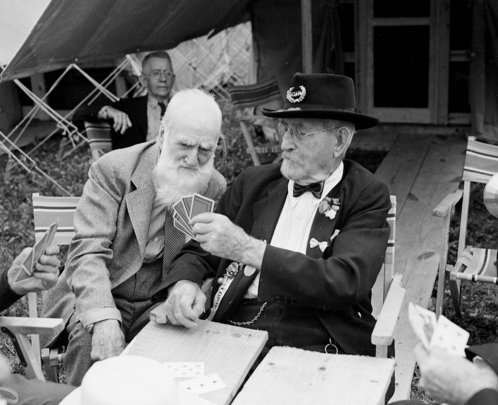 Elderly Civil War veterans playing cards together. 1930.