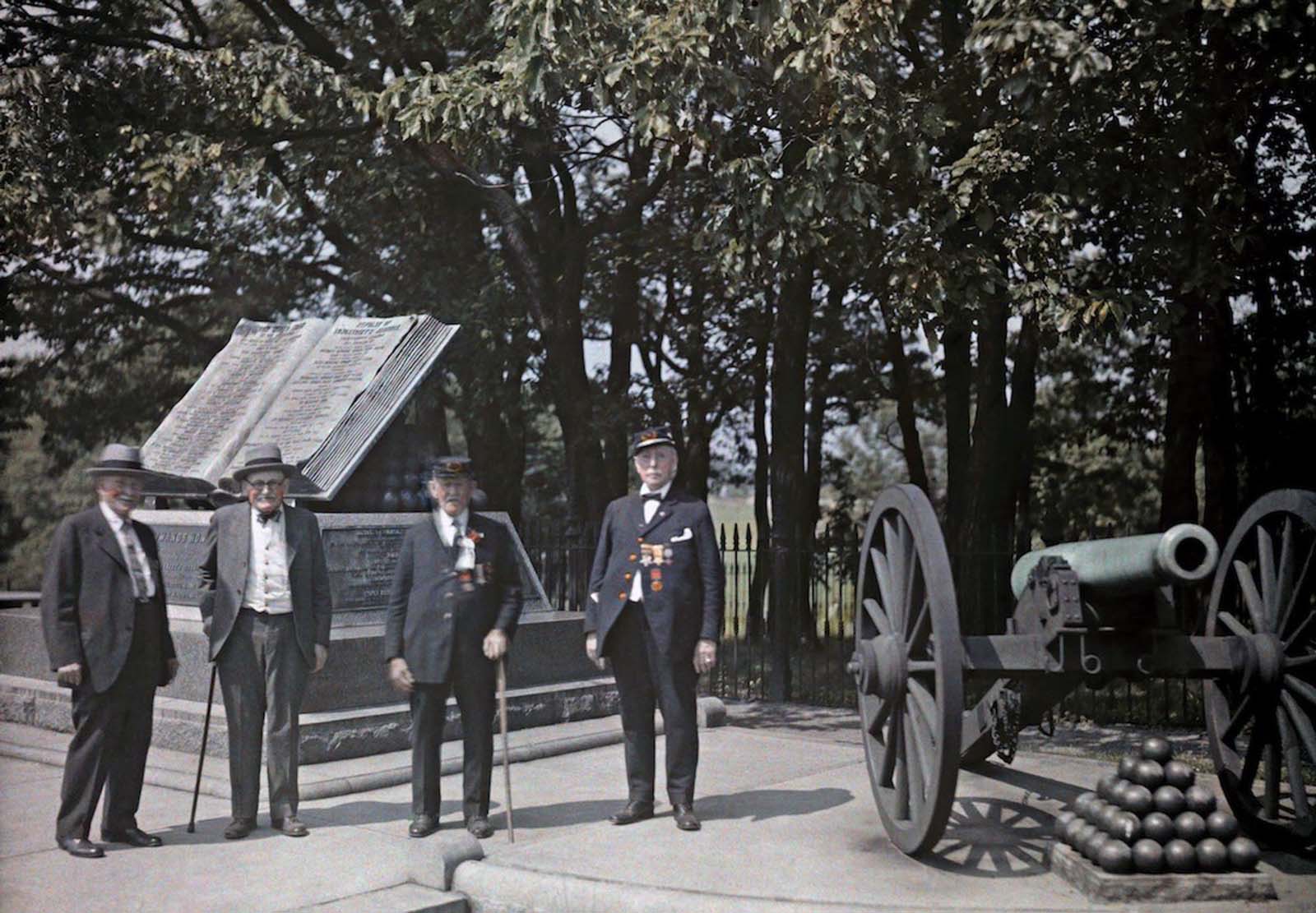 Gettysburg National Military Park, Gettysburg, Pennsylvania — Union Civil War veterans stand in front a monument at Gettysburg. 1931.