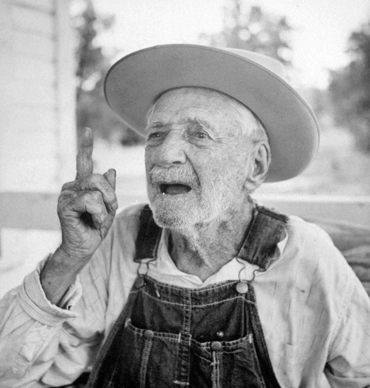 Self-proclaimed “Confederate Civil War veteran” sitting on his porch. 1956.