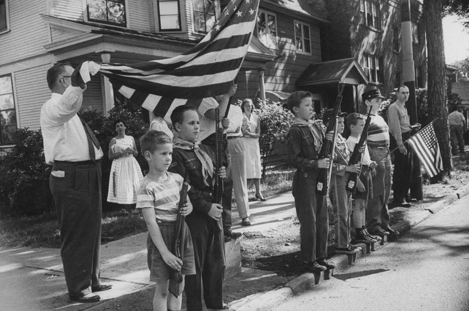 Boys standing at attention for the funeral of a Civil War veteran who was the last member of the Grand Army of the Republic. 1956.