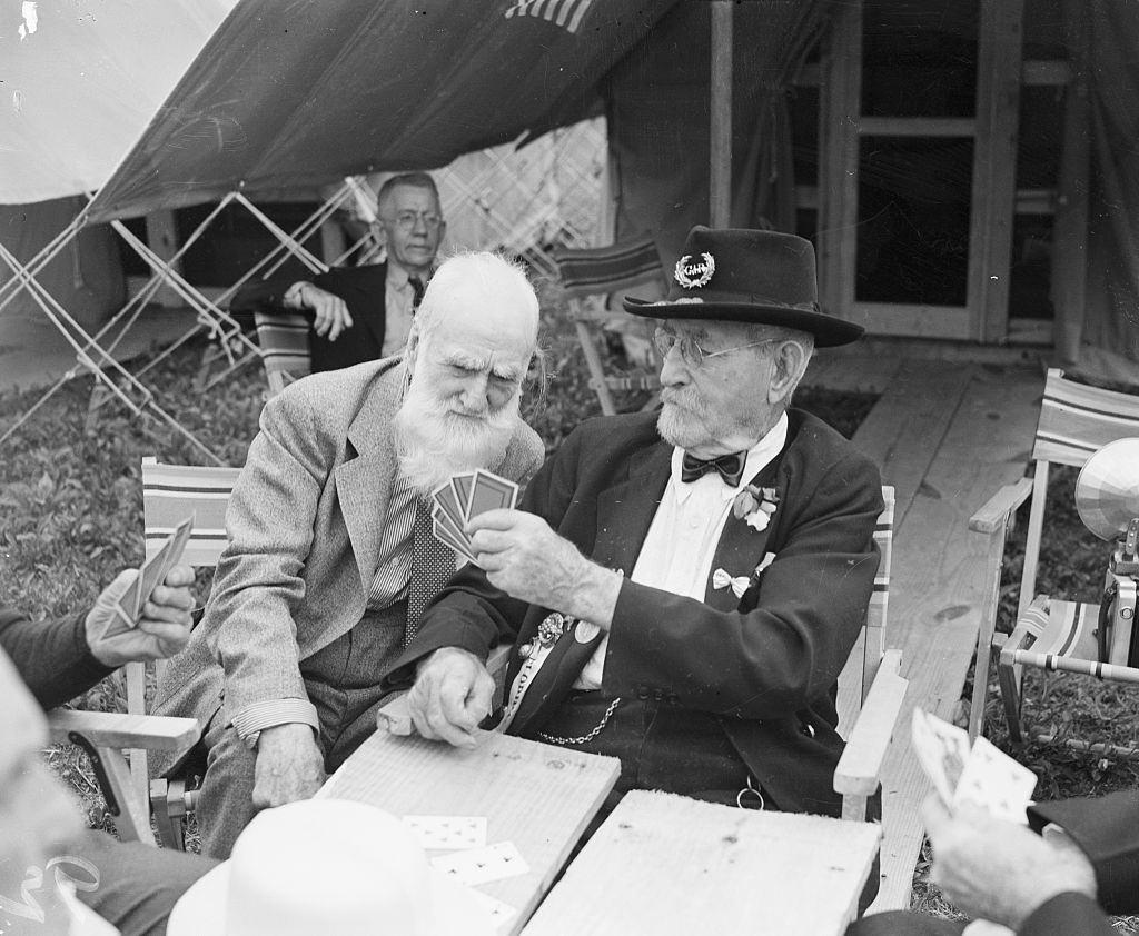 Elderly Civil War veterans playing cards together.